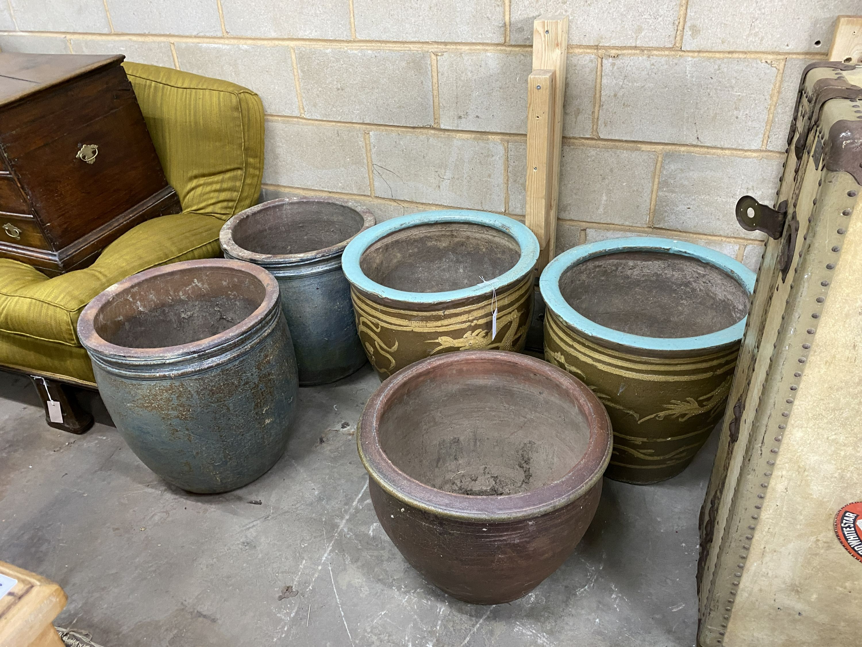 Two pairs of Chinese glazed terracotta circular jardinieres and one other (5), largest diameter 51cm, height 51cm